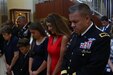 Brig. Gen. Michael Warmack, Chief of Army Reserve Command Operations, Plans and Training, and his family pray during the benediction portion of Warmack’s retirement ceremony at Fort Bragg, N.C., June 29, 2017. Warmack praised his mother, Toni, and his wife, Laura, in his continued success. (U.S. Army Reserve photo by Staff Sgt. Felix R. Fimbres)