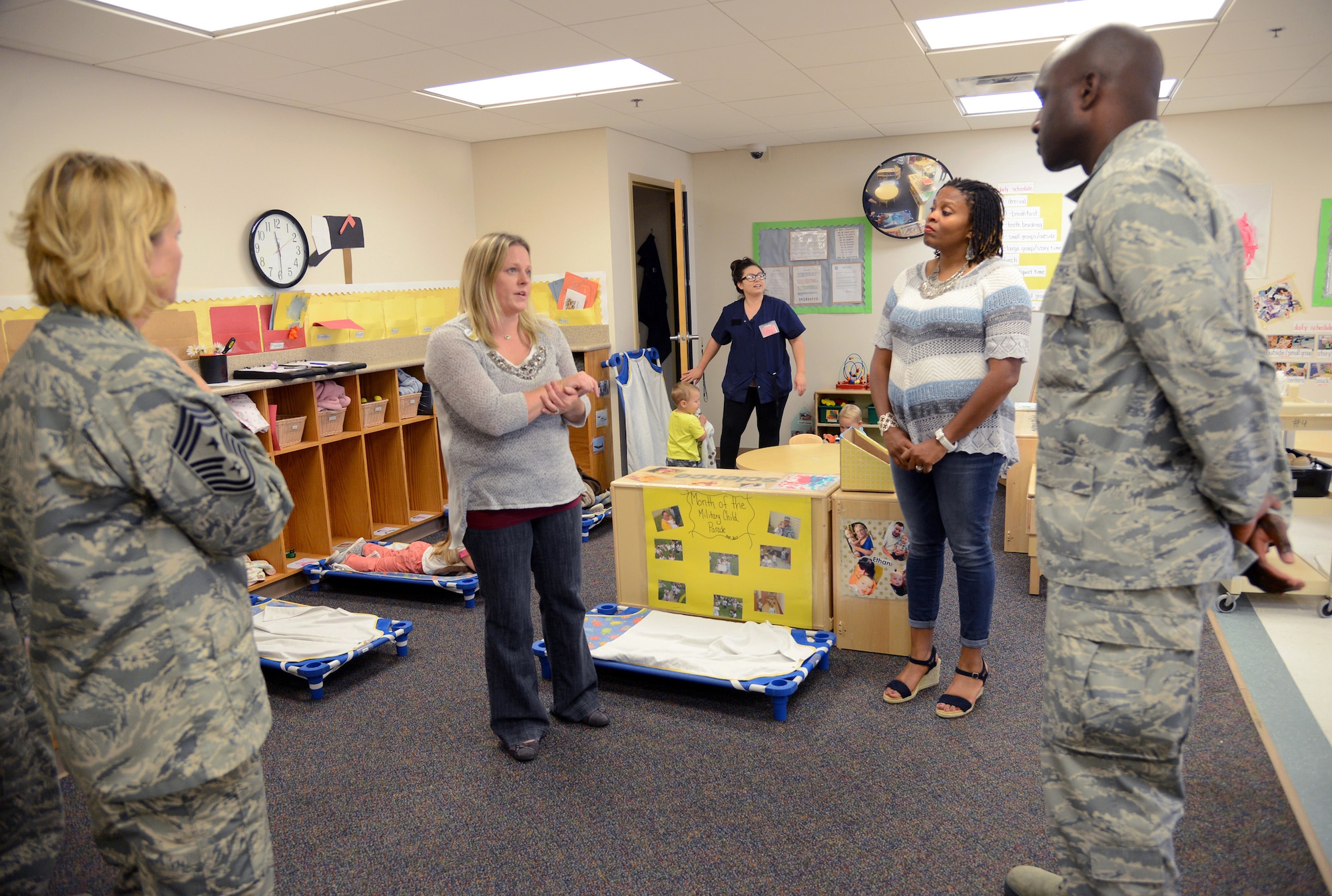 Kristie Mabie, director of Child Development Center West, second from left, briefs 72nd Air Base Wing Command Chief Master Sgt. Melissa Erb, Lori Bell and 72nd Air Base Wing Commander Col. Kenyon Bell about the day-to-day operations of her facility. Colonel Bell, along with 72nd Mission Support Group leadership, toured 72nd Force Support Squadron facilities June 21 to gain a better understanding of the general operations, concerns and needs of several of their facilities, including the MPS, Honor Guard, TLF's, Airmen and Family Readiness Center, AAFES and Outdoor Rec. (Air Force photo by Kelly White)