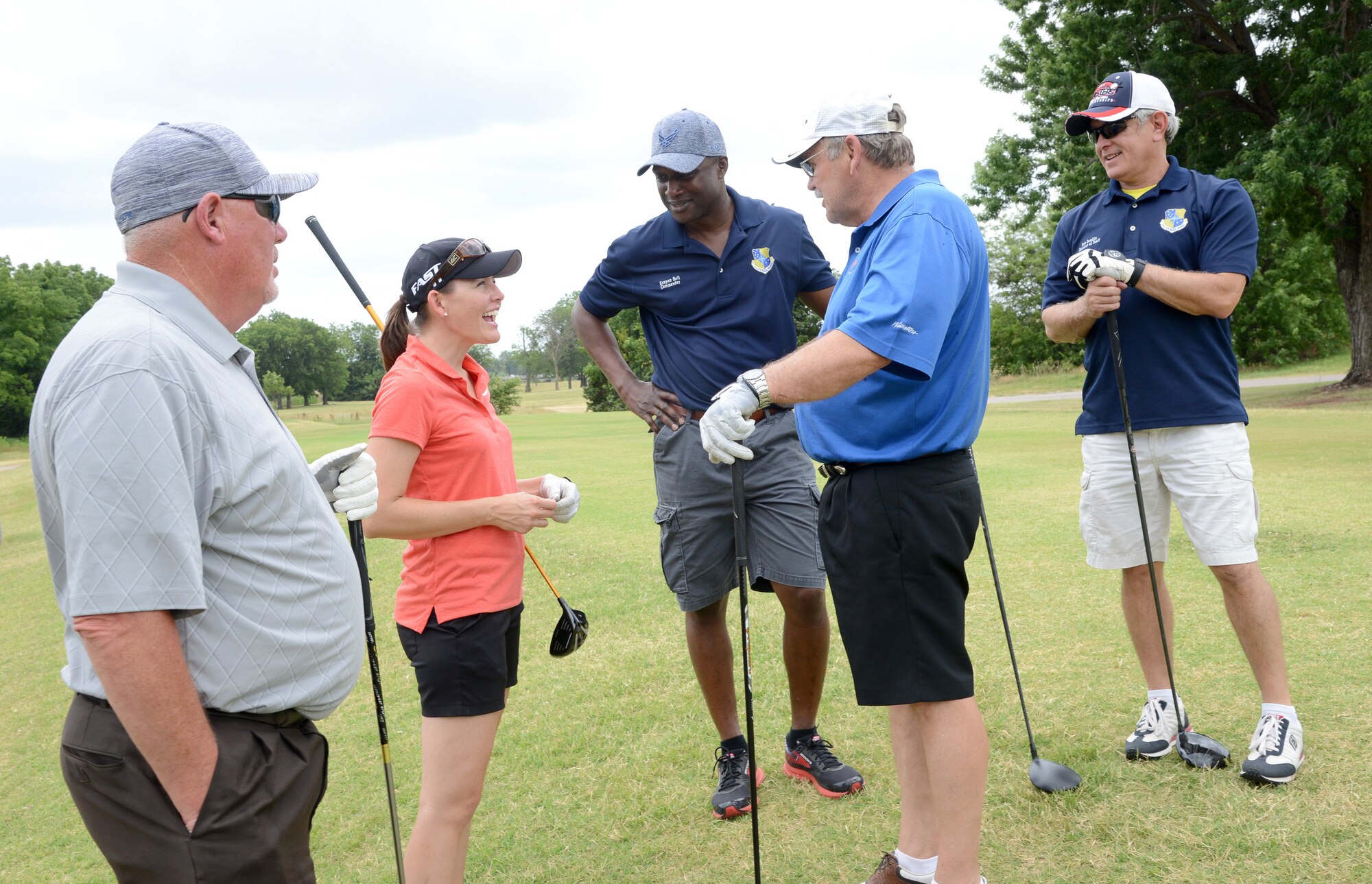 LPGA Golf Pro Stephanie Louden speaks with, from left, Oklahoma State Representative Roger Ford, 72nd Air Base Wing Commander Col. Kenyon Bell, Oklahoma Senator Jack Fry and 72nd Air Base Wing Director of Staff Bob Sandlin during the 75th Anniversary Golf Tournament June 23. Ms. Louden was on hand at one of the holes to make a shot for the teams, which they could then decide to use her ball for the rest of their play or not. She also led several golf workshops over the weekend.