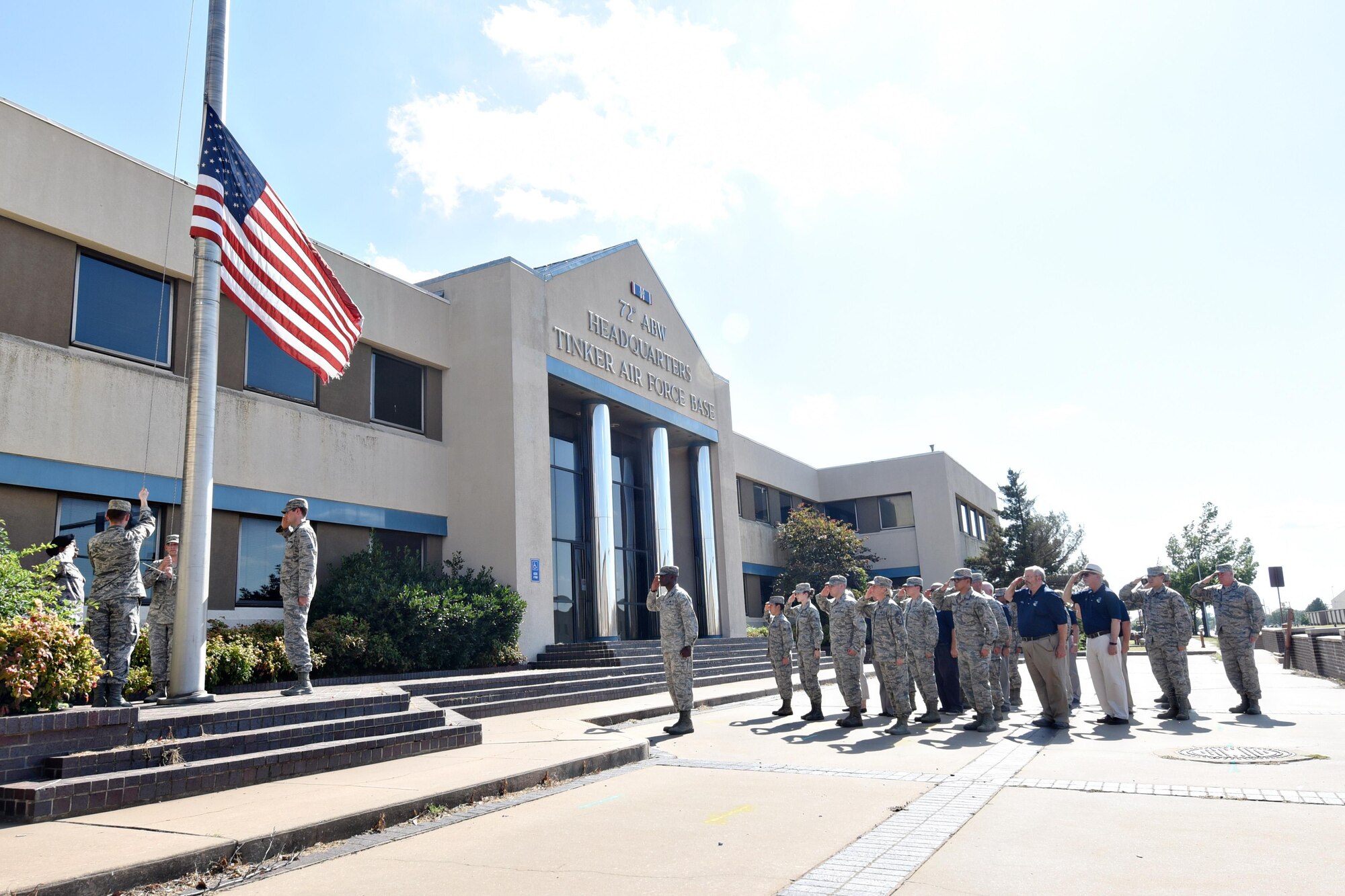 Members of the 72nd Air Base Wing gathered at the Bldg. 460 flag pole June 28 for the final retreat at the historic building. The land that has housed the 72nd ABW headquarters since October 1994 will soon be the new home of a state-of-the art training center for the 552nd Air Control Wing.