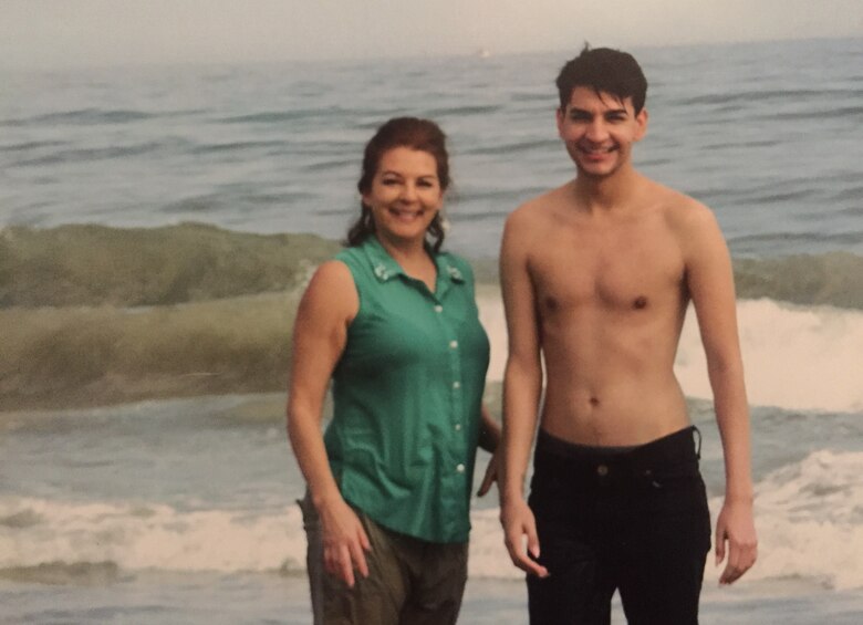 Senior Airman Irene Nelson, 57th Operations Support Squadron air traffic controller, Nellis Air Force Base, Nev., and mother on the beach. Nelson became the first Airman in Air Combat Command to have a gender transition recognized in official military records in February 2017. (Courtesy photo 