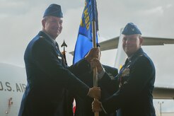 Col. Richard Mathews, right, outgoing 628th Mission Support Group commander, relinquishes command of the 628th MSG during a ceremony here officiated by Col. Robert Lyman, left, former 628th Air Base Wing commander, June 30, 2017. Mathews also held his retirement ceremony the same day after serving 28 years in the military.
