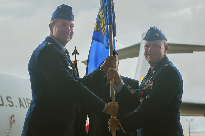 Col. Richard Mathews, right, outgoing 628th Mission Support Group commander, relinquishes command of the 628th MSG during a ceremony here officiated by Col. Robert Lyman, left, former 628th Air Base Wing commander, June 30, 2017. Mathews also held his retirement ceremony the same day after serving 28 years in the military.