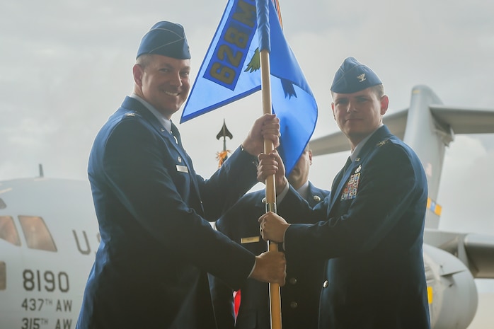 Col. Rockie Wilson, right, incoming 628th Mission Support Group commander, takes command during a ceremony officiated here by Col. Robert Lyman, left, former 628th Air Base Wing commander, June 30, 2017. Wilson took command from Col. Richard Mathews, outgoing 628th MSG commander.