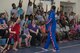 Harlem Globetrotter “Handles” calls for volunteers during a show, June 30, 2017, at Moody Air Force Base, Ga. During their visit, the globetrotters performed tricks, interacted with children, and instilled life lessons such as anti-bullying and the importance of school. (U.S. Air Force photo by Airman 1st Class Lauren M. Sprunk)