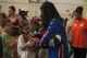 Harlem Globetrotter “TNT” signs an autograph for a youth center child after a show, June 30, 2017, at Moody Air Force Base, Ga. During their visit, the globetrotters performed tricks, interacted with children, and instilled life lessons such as anti-bullying and the importance of school. (U.S. Air Force photo by Airman 1st Class Lauren M. Sprunk)
