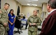 Maj. Jennifer Meadows (2nd from right), an optometrist and an Army Reserve Soldier, explains how local residents receive eye care to several distinguished visitors at the El Cenizo Community Center in Laredo, Texas June 27 during the Innovative Readiness Training (IRT) Mission. (Photo by Staff Sgt. Tomora Nance, U.S. Army North Public Affairs)