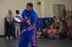 Harlem Globetrotter “Handles” performs a trick during a show, June 30, 2017, at Moody Air Force Base, Ga. During their visit, the globetrotters performed tricks, interacted with children, and instilled life lessons such as anti-bullying and the importance of school. (U.S. Air Force photo by Airman 1st Class Lauren M. Sprunk)