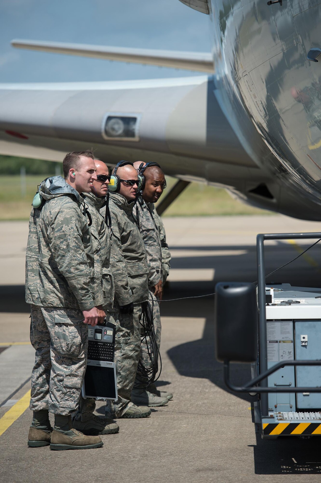 Maintenance Airmen from the 513th Air Control Group watch as an aircraft tow vehicle connects with a U.S. Air Force E-3 Sentry on June 7, 2017, at NATO Air Base Geilenkirchen, Germany. The 513th is providing airborne command and control to BALTOPS 2017, an exercise that involves 50 ships and submarines and 40 aircraft from 14 member nations. (U.S. Air Force photo/2nd Lt. Caleb Wanzer)