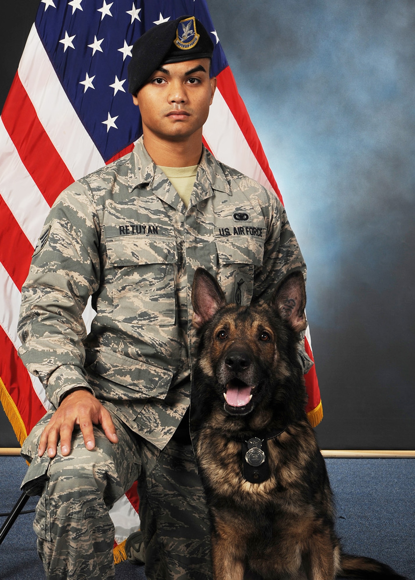 Senior Airman Keith Retuyan, 341st SFS military working dog handler, and MWD Aslan, pose for a photo at Malmstrom Air Force Base, Mont. Aslan was a German Shepherd, born in January 2008 who was certified as an explosive detection dog on June 8, 2010. Aslan was assigned to the 341st SFS in December 2010 and performed more than 9,500 hours to installation security as well as serving the state of Montana with more than 25 responses to bomb threats and a deployment to Iraq. Aslan also supported federal and local law enforcement agencies throughout the country in numerous explosive missions supporting presidential, foreign and domestic dignitaries. (U.S. Air Force photo)
