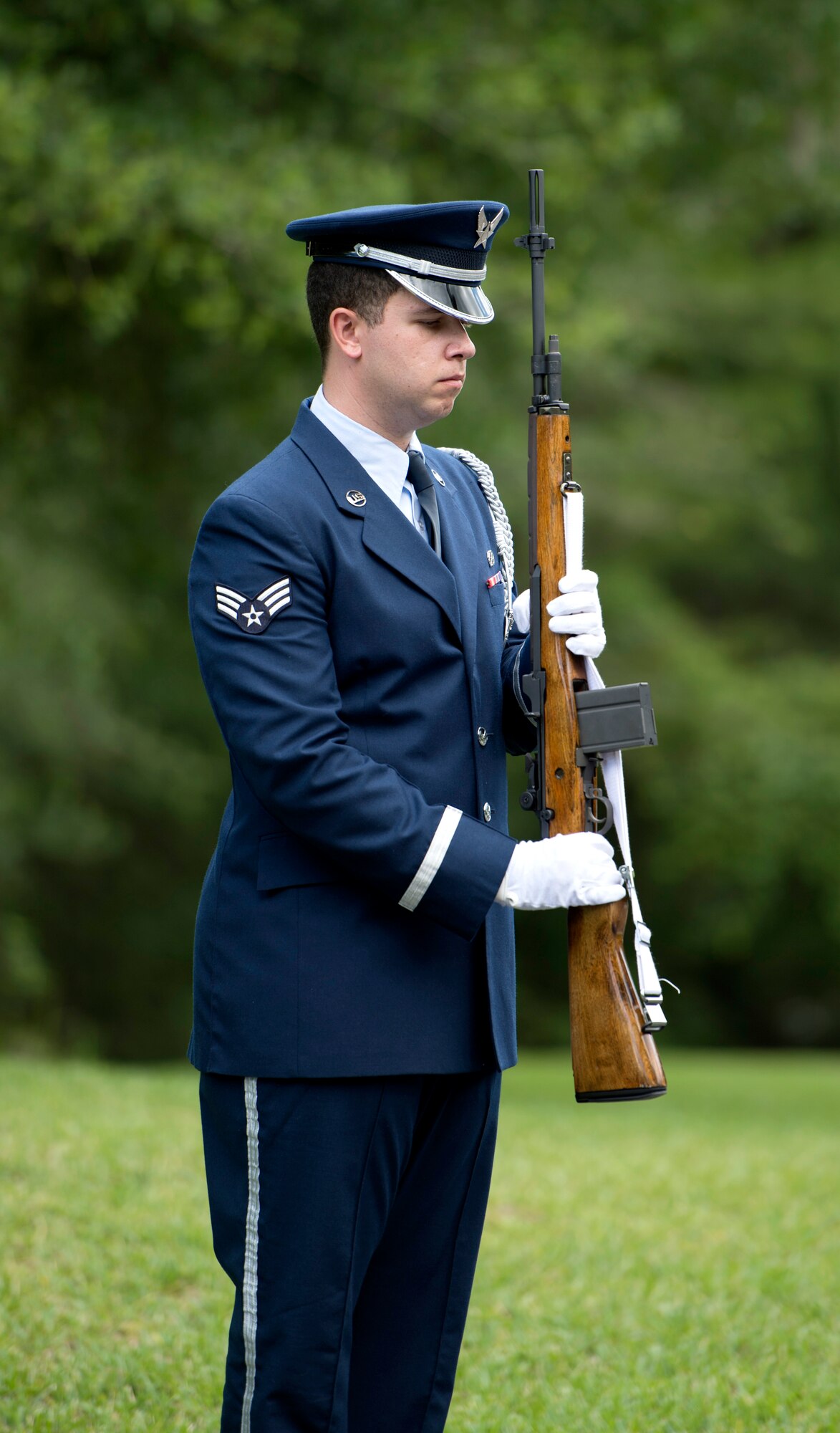 MacDill Air Force Base U.S. Air Force Honor Guardsman Senior Airman John Jordan, a crew chief assigned to the 6th Maintenance Squadron, prepares to fire volleys to honor the passing of a United States Air Force retiree at Florida National Cemetery, June 9, 2017. As a rendition of TAPS plays, the firing party fires a total of three volleys to honor the service and sacrifice of the service member. (U.S. Air Force Photo by Airman 1st Class Rito Smith) 

