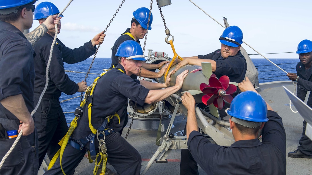 Sailors load an MK 46 torpedo into a surface vessel torpedo tube aboard the guided-missile destroyer USS Pinckney in waters off Guam, June 28, 2017. The Pinckney is operating in the U.S. 7th Fleet area of responsibility. Navy photo by Petty Officer 2nd Class Craig Z. Rodarte