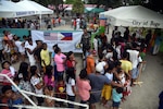 Local community member’s form a line outside of a Pacific Angel 2017 health services site in Northern Cebu Province, Bogo City, Philippines, June 26, 2017. PACANGEL is a multilateral humanitarian assistance civil military engagement, which improves military-to-military partnerships in the Pacific while also providing medical health outreach, civic engineering projects and subject matter exchanges among partner forces. 