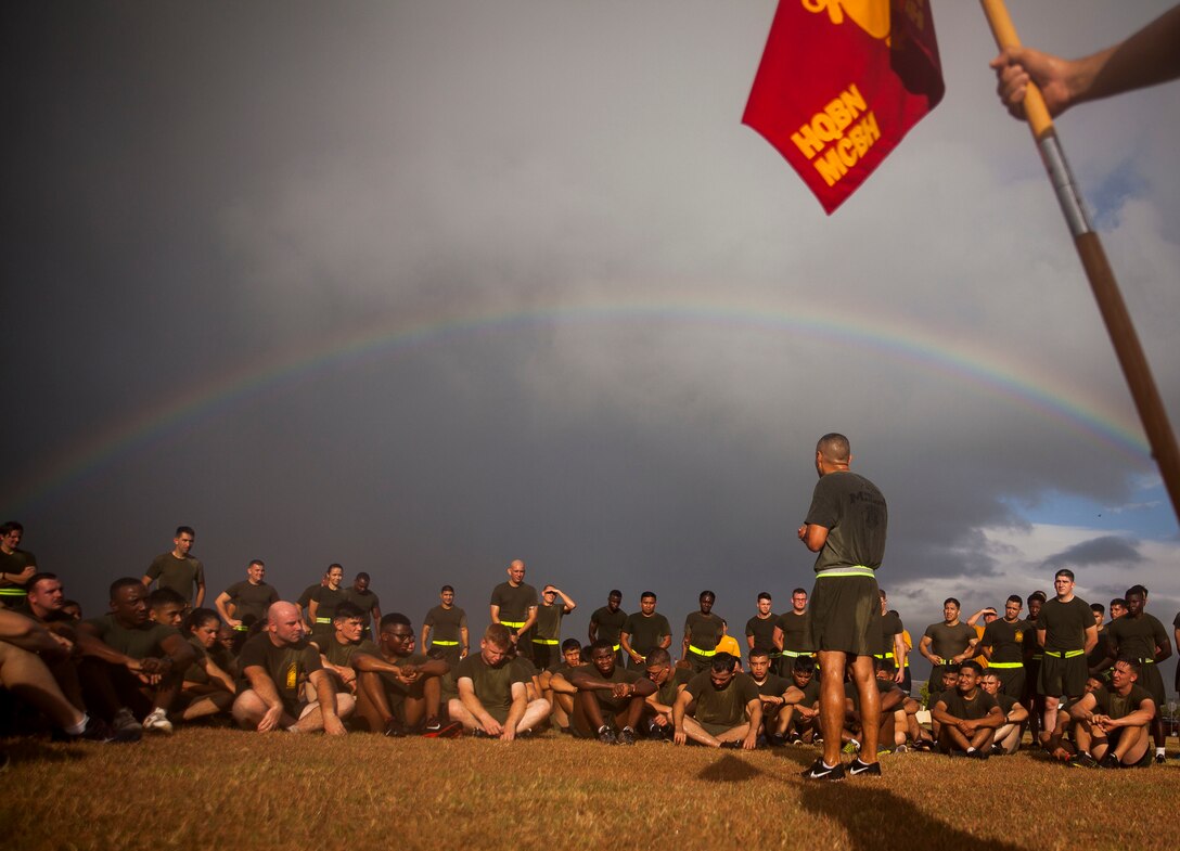 1st Sgt. Erick Velez, the company first sergeant of Headquarters Company, Headquarters Battalion, addresses Marines and Sailors of the battalion after a motivational run aboard Marine Corps Base Hawaii on June 30, 2017. The battalion conducted the motivational run to build unit cohesion and boost morale amongst the battalion. (U.S. Marine Corps photo by Lance Cpl. Matthew Kirk)