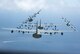 Four U.S. Air Force MC-130J Commando IIs from the 17th Special Operations Squadron execute a simultaneous overhead break June 22, 2017 off the coast of Okinawa, Japan, during a mass launch training mission. Airmen from the 17th SOS conduct training operations often to ensure they are always ready perform a variety of high-priority, low-visibility missions throughout the Indo-Asia-Pacific-Region. (U.S. Air Force photo by Senior Airman John Linzmeier)