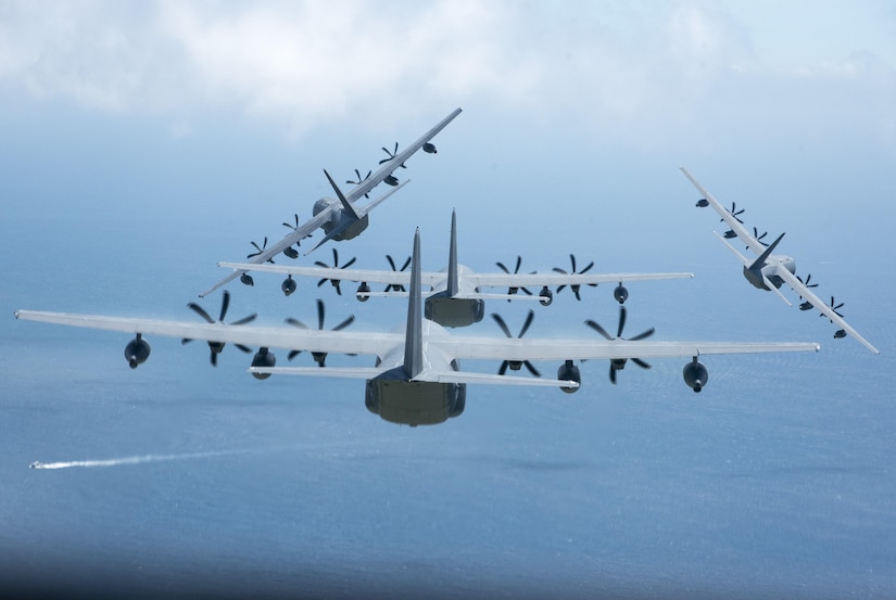 Four U.S. Air Force MC-130J Commando IIs from the 17th Special Operations Squadron execute a simultaneous overhead break June 22, 2017 off the coast of Okinawa, Japan, during a mass launch training mission. Airmen from the 17th SOS conduct training operations often to ensure they are always ready perform a variety of high-priority, low-visibility missions throughout the Indo-Asia-Pacific-Region. (U.S. Air Force photo by Senior Airman John Linzmeier)