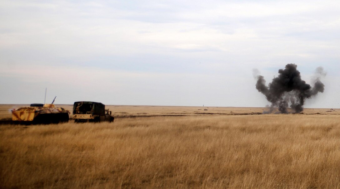 Marines and Romanian soldiers breach an obstacle during Exercise Platinum Eagle at Smardan Training Area, Romania, Feb. 24, 2017. Marine Corps photo by Cpl. Sean J. Berry