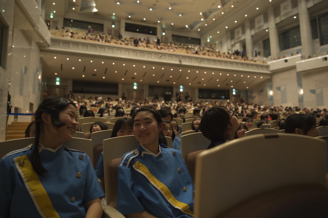 Japanese students from the Marifu Elementary School laugh and interact before the start of the 7th annual U.S.-Japan Friendship Concert at the Sinfonia Iwakuni Concert Hall in Iwakuni City, Japan, Feb. 24, 2017. The concert is a way for the student performers to experience different cultures and communicate with each other through music despite the language barrier. (U.S. Marine Corps photo by Lance Cpl. Carlos Jimenez)
