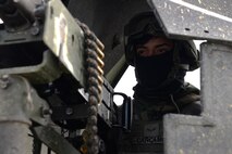 U.S. Air Force Airman 1st Class Bryan Carcamo, 51st Security Forces flight member, stands guard in a Humvee during Exercise Beverly Herd 17-1 at Osan Air Base, Republic of Korea, March 1, 2017. Defenders train and integrate with host nation counterparts to be ready to defend the base and its personnel at all times. (U.S. Air Force photo by Airman 1st Class Gwendalyn Smith)