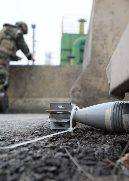 U.S. Air Force Staff Sgt. Daniel Johnsen, 51st Explosive Ordnance Disposal Squadron equipment noncommissioned officer-in-charge, prepares to render safe procedures before removing a found simulated unexploded ordnance, during Exercise Beverly Herd 17-1 at Osan Air Base, Republic of Korea, March 1, 2017. The exercise enabled Team Osan to validate base defense protection measures, combat operations and the ability to sustain forces in adverse environments.  (U.S. Air Force photo by Tech. Sgt. Ashley Tyler)