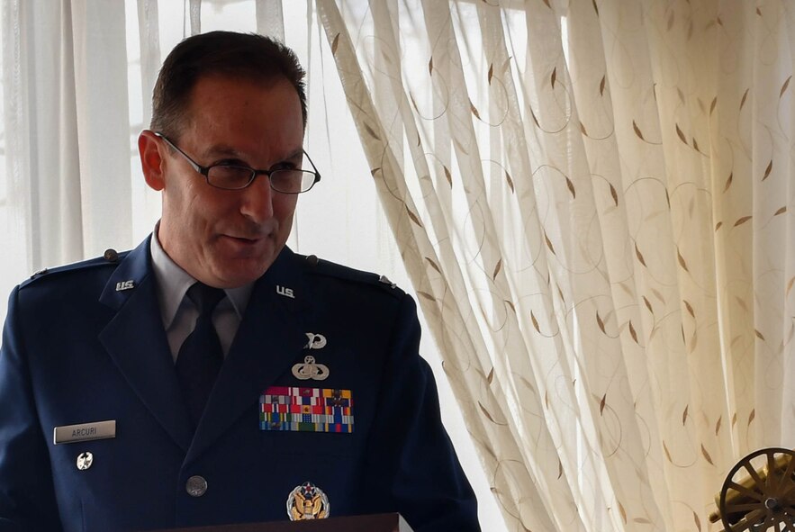 Col. Scott Arcuri, U.S. Air Forces in Europe directorate of manpower, personnel, and services, speaks at a dual retirement ceremony on Ramstein Air Base, Germany, Feb. 24, 2017. John and Colynn Hamilton, USAFE management analyst and human resources specialist respectively, as well as husband and wife, retired after serving more than 80 years combined as government employees. (U.S Air Force photo by Senior Airman Tryphena Mayhugh)