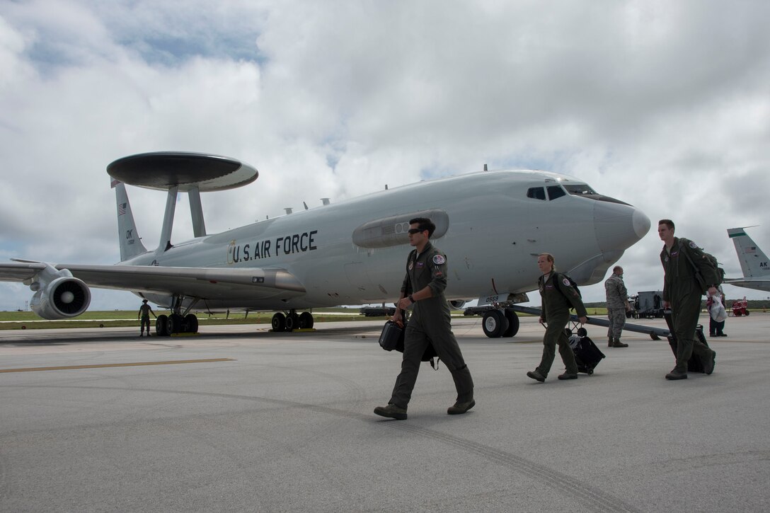 Aircrew from the 961st Airborne Air Control Squadron prepare to board an E-3 Sentry during annual exercise Cope North Feb. 23, 2017, at Andersen Air Force Base, Guam. The 961st AACS is a combat-ready E-3 Sentry squadron providing airborne command and control, long-range surveillance, detection, and identification information for commanders in support of U.S. goals. (U.S. Air Force photo by Senior Airman John Linzmeier)