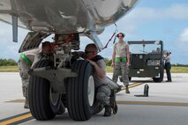 U.S. Air Force Airmen from the 962nd Aircraft Maintenance Unit prepare to park an E-3 Sentry from the 961st Airborne Air Control Squadron during annual exercise Cope North Feb. 23, 2017, at Andersen Air Force Base, Guam.  Cope North is an annual exercise which serves as a keystone event to promote stability and security throughout the Indo-Asia-Pacific region by enabling regional forces to hone vital readiness skills. (U.S. Air Force photo by Senior Airman John Linzmeier)