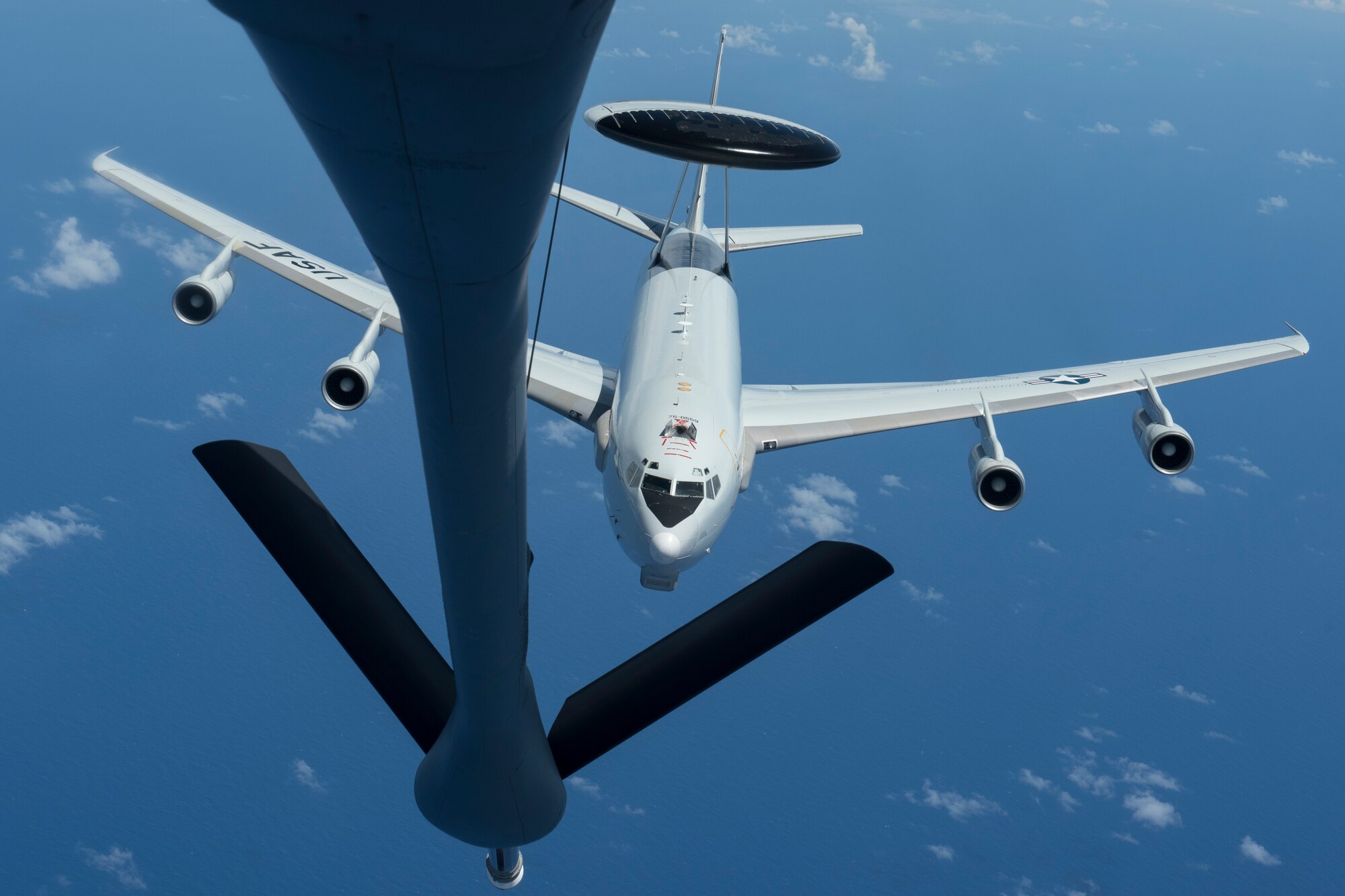 A U.S. Air Force E-3 Sentry, from the 961st Airborne Air Control Squadron, receives fuel from a 909th Air Refueling Squadron KC-135 Stratotanker during annual exercise Cope North March, 1, 2017 off the coast of Guam. Cope North is a multilateral, U.S. Pacific Air Forces-sponsored, field training exercise scheduled from Feb. 15 through Mar. 3. The mission focuses on air combat tactics and large force employment in an effort to enhance interoperability among U.S., Australian and Japanese forces. (U.S. Air Force photo by Senior Airman John Linzmeier)