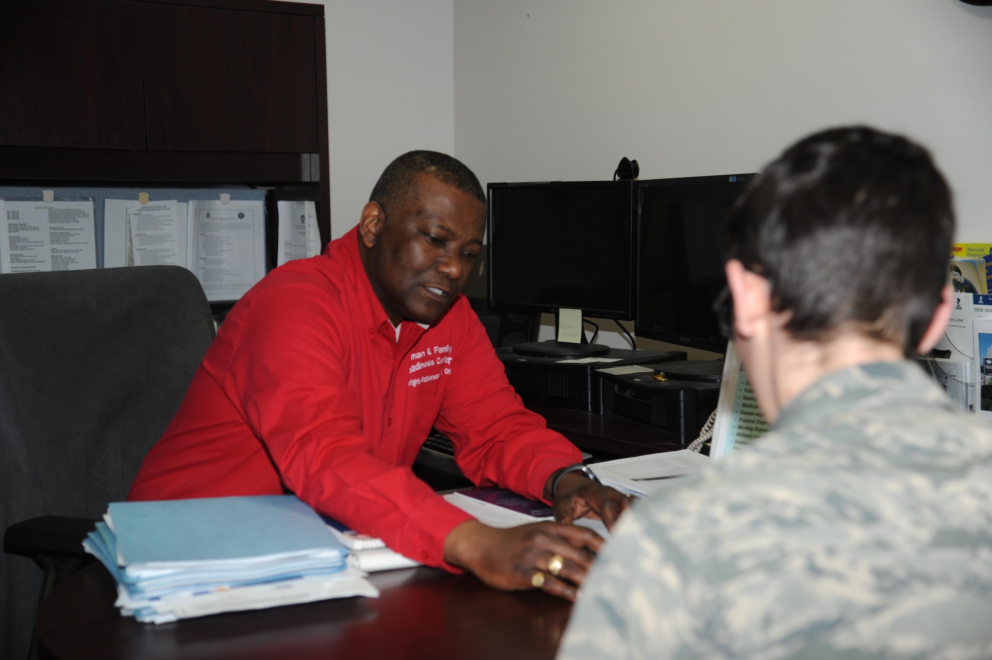 Gary Sapp, community readiness consultant at the Airman & Family Readiness Center and Air Force Aid Society officer for Wright-Patterson AFB, reviews an Airman’s finances to develop a budget and to determine if the Airman needs assistance from the AFAS. The AFAS is a non-profit organization and the official charity for the U.S. Air Force to help relieve financial hardships of Air Force members and their families and to assist them in financing their higher education goals. (U.S. Air Force photo/Myra Saxon)