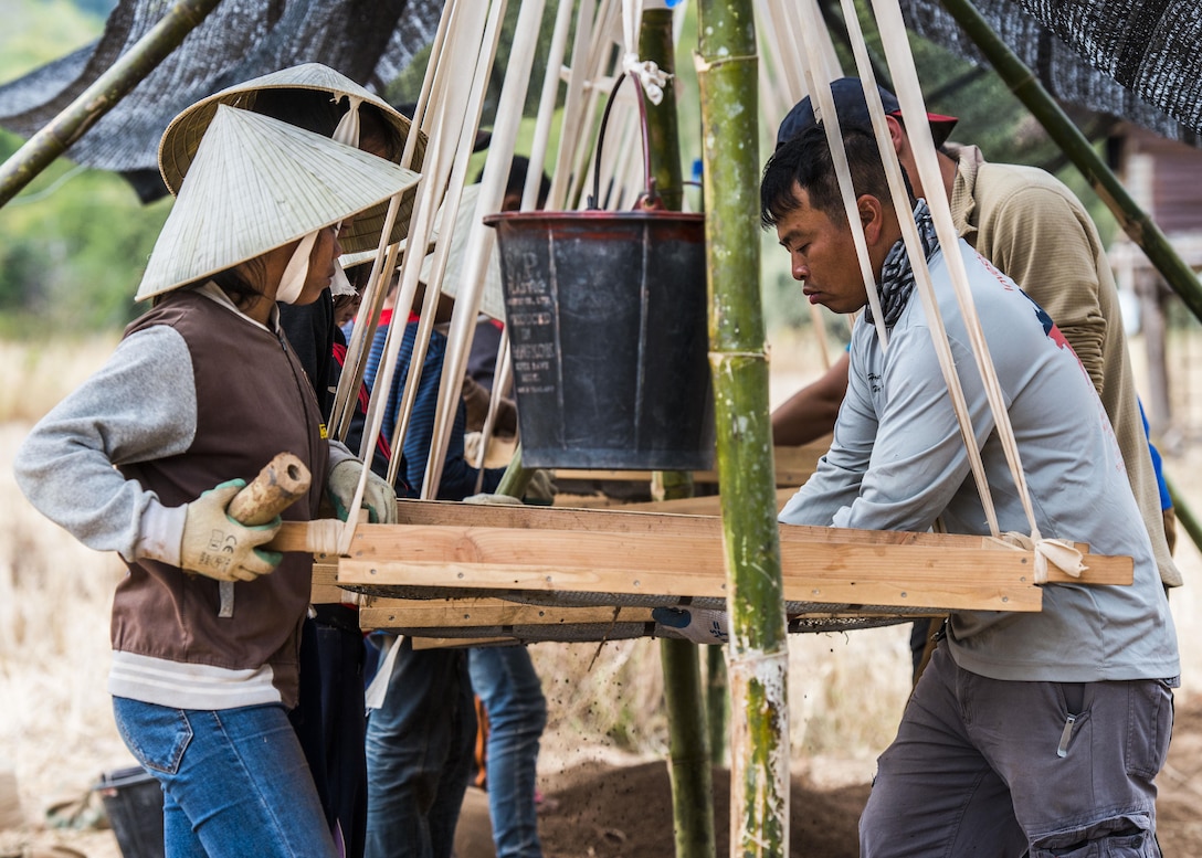 U.S. Army Staff Sgt. Francis Sangiamvongse, linguist, screens soil with local villagers during excavation operations as part of the Defense POW/MIA Accounting Agency’s mission in the Khammouane Province, Laos, January 29, 2017. Recovery Team Three executed excavation operations in search of two missing U.S. Air Force pilots who crashed while on a visual reconnaissance mission during the Vietnam War over 48 years ago. DPAA’s mission is to provide the fullest possible accounting for our missing personnel to their families and the nation. 