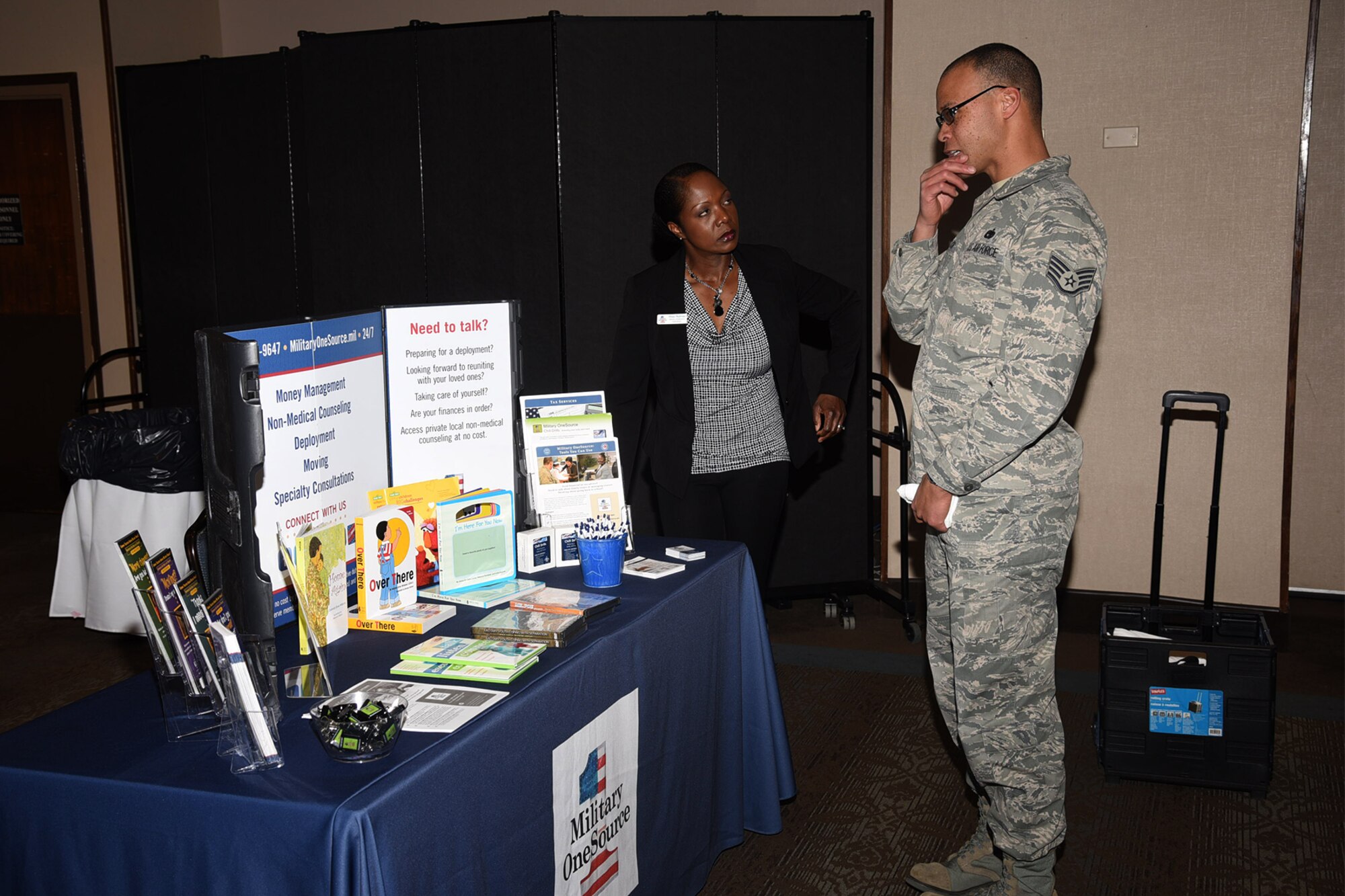PETERSON AIR FORCE BASE, Colo. – Rhee Rollman, Military One Source representative, speaks with SSgt Jeffrey Chin, Joint Personal Property Shipping Office counselor, at the Financial Fair at the Club, Peterson Air Force Base, Colo., Feb. 28, 2017. The Financial Fair offers money management, deployment and moving consultations.