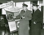 Defense Supply Agency Director Army Lt. Gen. Andrew McNamara visits the DSA offices in Battle Creek, Michigan, for the dedication of the Defense Logistics Services Center in February 1963.