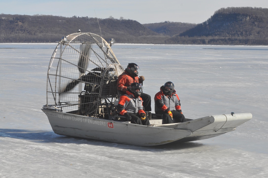 FRONTENAC, Minn. –Brandon Olson works the auger and Thomas Burrows, both St. Paul District channels and harbors, measures the ice at the Mississippi River’s Lake Pepin Feb. 15. Starting at around 8:15 a.m. at Camp Lacupolis, crew members rode an airboat to various points of the lake and used an auger to drill through the ice. They then measured the thickness of the ice through the holes. They said the thickest ice measured 17 inches, located about 1 mile southeast of Lake City. But that quickly changed just 3 miles north of Lake City, where the crew encountered open water. – USACE photos by John Barker