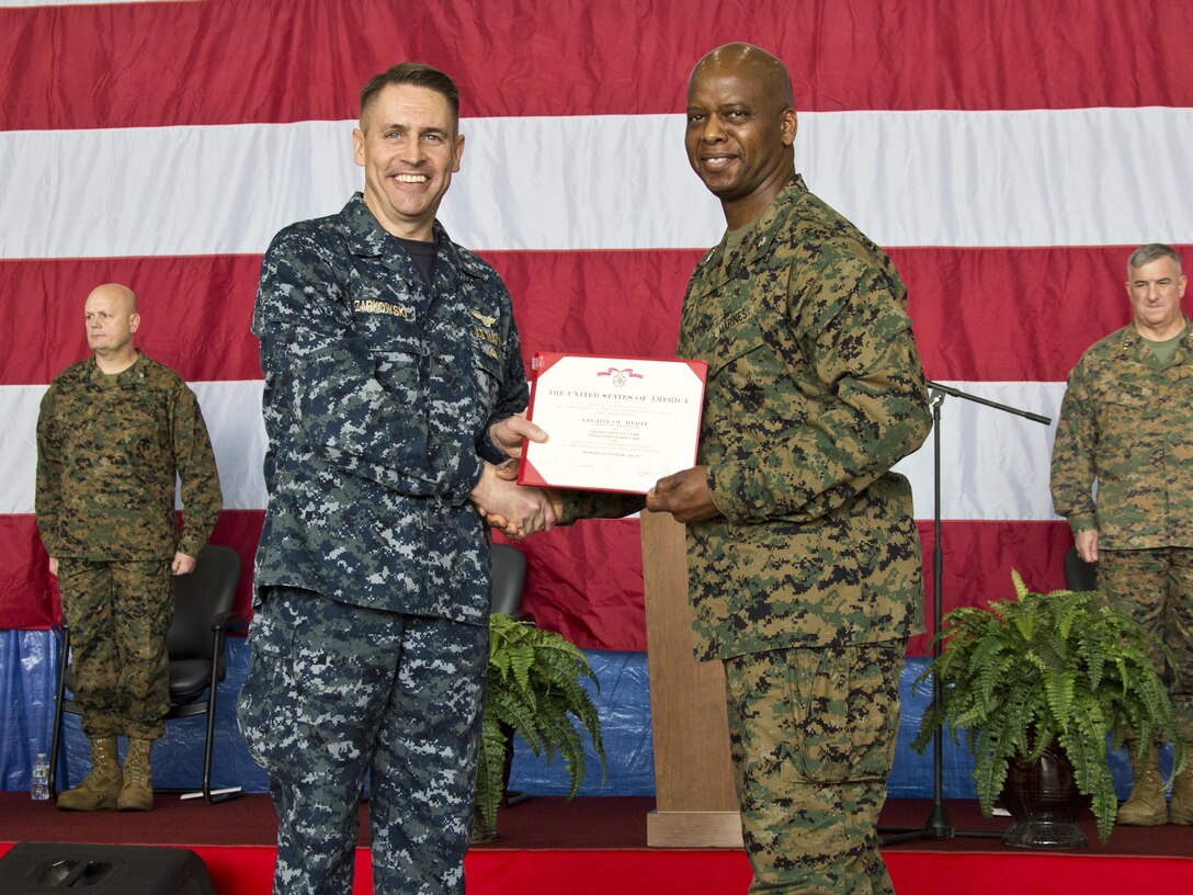 U.S. Navy Rear Adm. Michael W. Zarkowski, left, poses for a photo with U.S. Marine Corps Col. Vincent E. Clark, former commanding officer of Marine Corps Air Station Cherry Point Fleet Readiness Center East (FRC East), during Clark's retirement ceremony, Cherry Point, N.C., Feb. 24, 2017. Gen. Glenn M. Walters, assistant commandant of the Marine Corps, retired Clark after the Change of Command ceremony where Col. Clarence T. Harper III took command of FRC East. (U.S. Marine Corps photo by Lance Cpl. Hailey D. Clay)