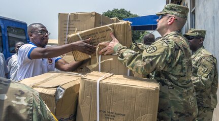 U.S. Army Maj. Keith Lathrop, nurse anesthetist assigned to Brooke Army Medical Center, helps unload and inventory medical supplies the U.S. Army is donating following the closing ceremony of Medical Readiness Training Exercise 17-2 at the 37th Military Hospital in Accra, Ghana, Feb. 22. MEDRETE 17-2 includes participants from the Ghanaian government, U.S. Army Africa, Brooke Army Medical Center and the North Dakota National Guard. It is the second in a series of medical readiness training exercises that USARAF is scheduled to facilitate in various countries in Africa. The exercise offers opportunities for the partnered militaries to cooperate on medical specific tasks, share best practices and improve medical treatment processes. 