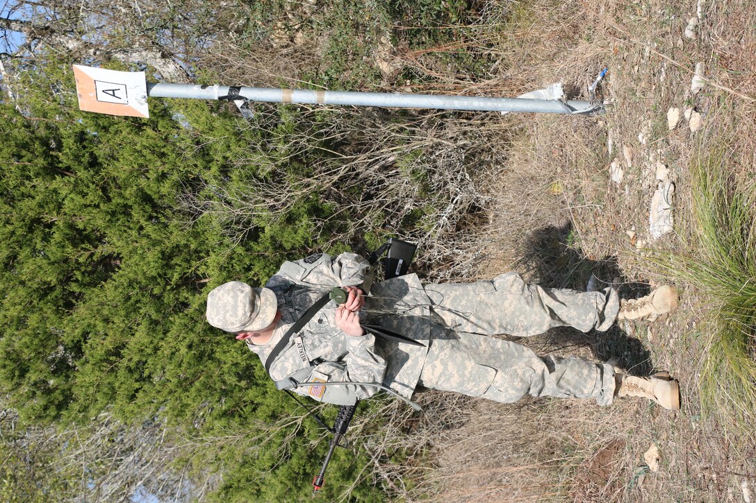 Spc. Evin Weekley, Southeast Medical Area Readiness Support Group, shoots an azimuth with his compass to head to his next point for the daytime land navigation event of the Best Warrior Competition at Camp Bullis, Texas, 10 Feb.  Soldiers from the Medical Readiness and Training Command, Northeast MARSG, Southeast MARSG, Central MARSG and Western MARSG competed in the Best Warrior Competition for their respective commands at Camp Bullis, Texas, 8-12 Feb., 2017. 
