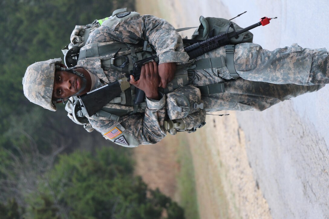 Sgt. Terrelle Fields, Northeast Medical Area Readiness Support Group, leads the pack during the ruck march event of the Best Warrior Competition at Camp Bullis, Texas, 11 Feb. Fields was the first competitor to complete the 4-mile march, doing so in 45:03.  Soldiers from the Medical Readiness and Training Command, Northeast MARSG, Southeast MARSG, Central MARSG and Western MARSG competed in the Best Warrior Competition for their respective commands at Camp Bullis, Texas, 8-12 Feb., 2017. 