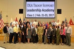 DLA Troop Support Commander Army Brig. Gen. Charles Hamilton (center) poses with the inaugural class of the organization’s Leadership Academy Feb. 23 in Philadelphia. The three-day workshop was created to give new supervisors the tools needed to be effective leaders. 