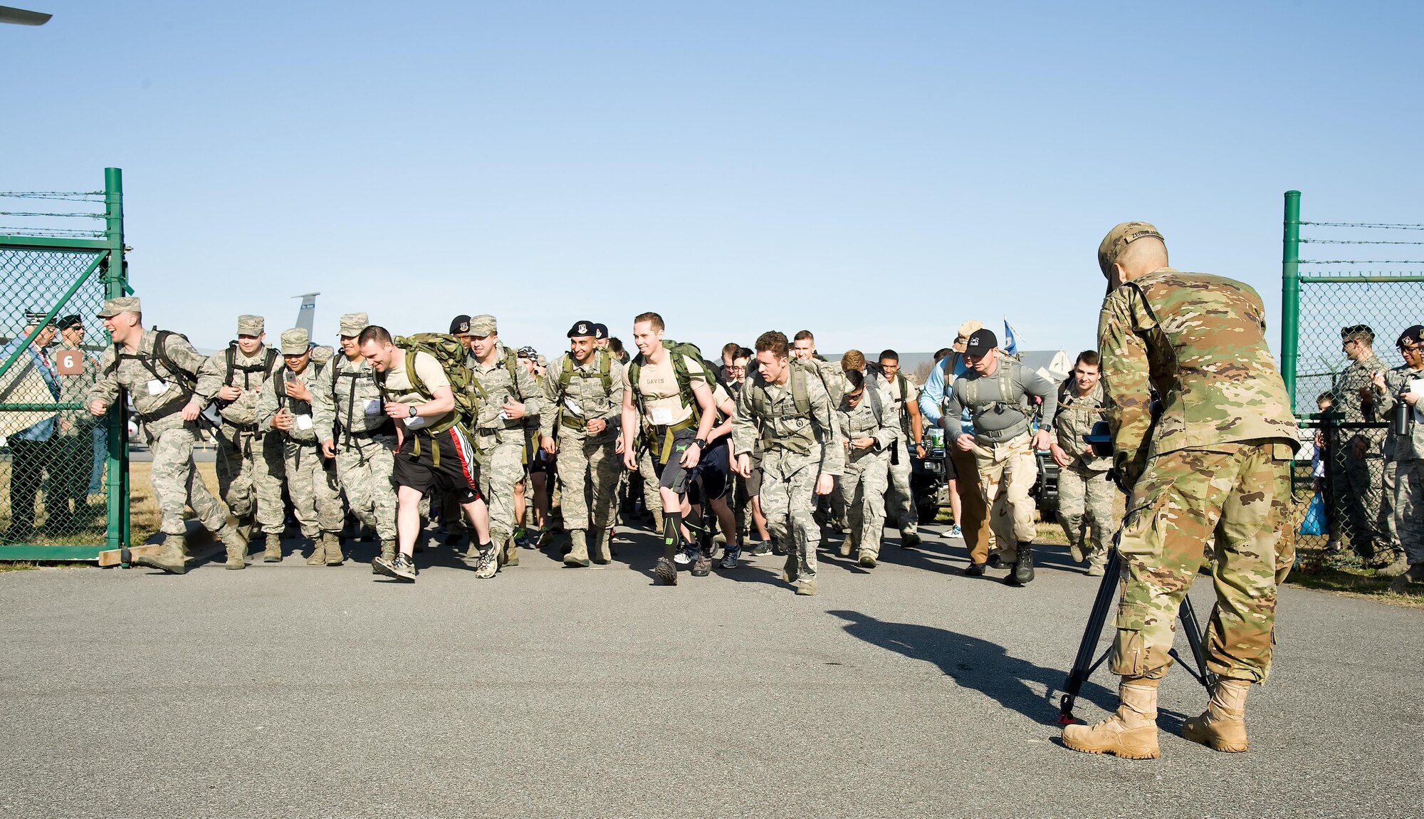 Army Pfc. Anthony Zendejas IV, a Video Production and Documentation (VPD) student from the Defense Information School, Fort Meade, Md., videotapes the start of the 18th Annual Security Forces Ruck March, Feb. 25, 2017, at the Air Mobility Command Museum on Dover Air Force Base, Del. Zendejas and three other VDP students on his team chose to documented the 6.2 mile ruck march on Dover AFB commemorating the Korean War Battle of the Chosin Reservoir, November-December 1950. (U.S. Air Force photo by Roland Balik)