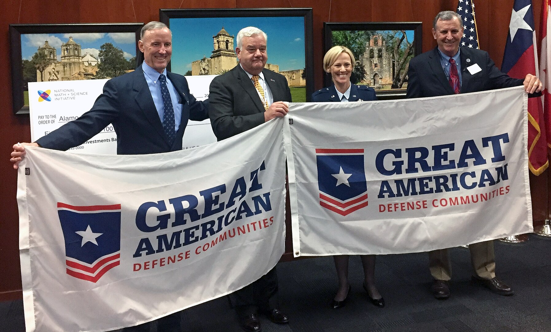 (From left) Mike Gallagher, City of San Antonio councilman, District 10; Bill Parry, vice president, Association of Defense Communities; Brig. Gen. Heather Pringle, commander, 502nd Air Base Wing and Joint Base San Antonio; Chris Schuchart, Medina County judge and chair, Alamo Area Council of Government celebrate the Great American Defense Communities Feb. 27. 