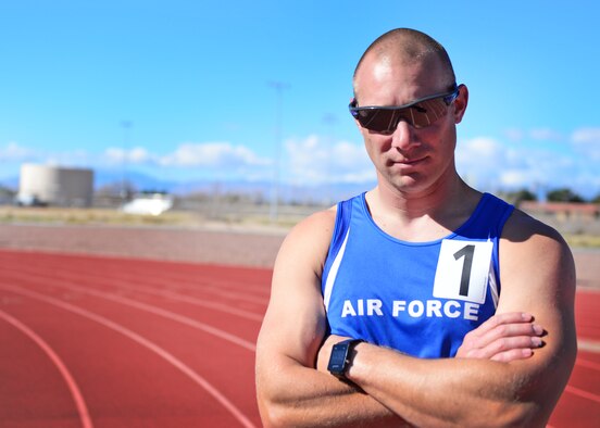 U.S. Air Force Tech. Sgt. Ben Seekell, 2017 AF Trials competitor, poses for a photo after the 1,500 meter run during Track and Field qualifications at the Warrior Fitness Center Feb. 28, 2017 at Nellis Air Force Base, Nev. During a 2011 improvised explosive device attack in Afghanistan, Seekell attributes his survival to the quick action of his teammates. (U.S. Air Force photo by Senior Airman Chip Pons)