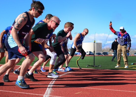 U.S. Air Force Tech. Sgt. Ben Seekell (right), 2017 AF Trials competitor, lines up for the start of the 1,500 meter run during Track and Field qualifications at the Warrior Fitness Center Feb. 28, 2017 at Nellis Air Force Base, Nev. Despite losing a leg during a 2011 improvised explosive device attack in Afghanistan, Seekell claims to be stronger and faster than ever. (U.S. Air Force photo by Staff Sgt. Alexx Pons)