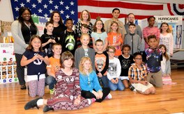 Fourth-grade students of Marrington Elementary (MNE) School pose for a photo with teachers and science fair judges following the MNE Science Fair Feb. 21, at Joint Base Charleston – Weapons Station.