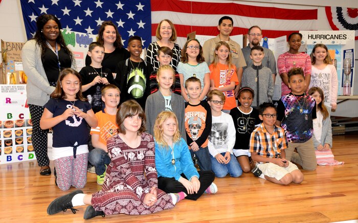 Fourth-grade students of Marrington Elementary (MNE) School pose for a photo with teachers and science fair judges following the MNE Science Fair Feb. 21, at Joint Base Charleston – Weapons Station.