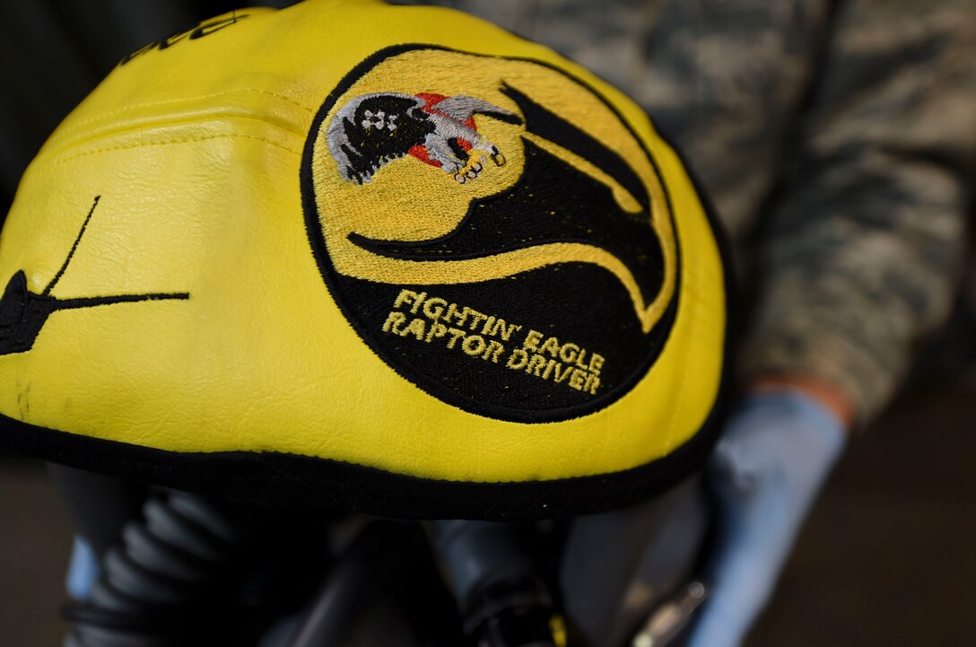 A 1st Operation Support Squadron aircrew flight equipment technician moves an inspected helmet to its locker area at Joint Base Langley-Eustis, Va., Feb. 27, 2017. The 1st OSS AFE personnel issue, inspect, fit, repair and maintain flight equipment such as parachutes, helmets and oxygen equipment for 1st Fighter Wing pilots. (U.S. Air Force photo by Staff Sgt. Natasha Stannard)
