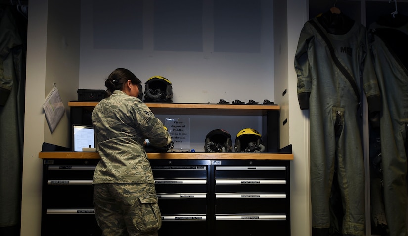U.S. Air Force Airman 1st Class Femylyn Plan, 1st Operation Support Squadron aircrew flight equipment technician, inspects F-22 Raptor helmets at Joint Base Langley-Eustis, Va., Feb. 27, 2017. The 1st OSS, is a part of the1st Fighter Wing, which flies, maintains and supports one third of the U.S. Air Force’s F-22 Raptor fleet. (U.S. Air Force photo by Staff Sgt. Natasha Stannard)