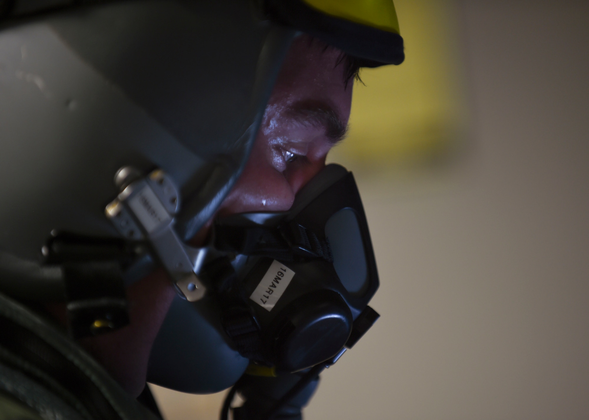 A pilot tests his oxygen mask before flying at Joint Base Langley-Eustis, Va., Feb. 27, 2017. Pilots tests their oxygen masks before each flight to ensure they are in working order providing safety for the entirety of their world-wide missions. (U.S. Air Force photo by Staff Sgt. Natasha Stannard)