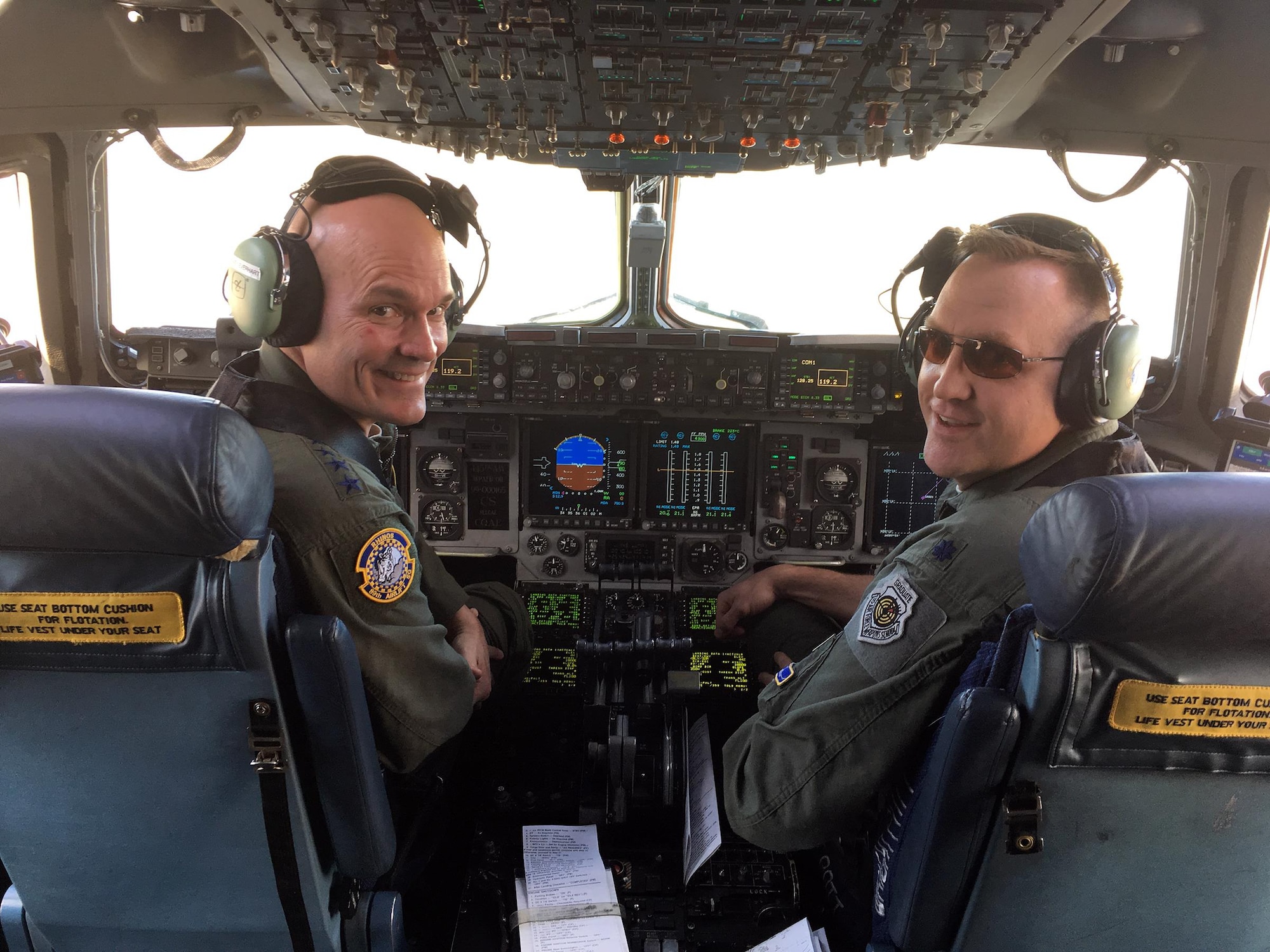 Gen. Carlton D. Everhart, II, Commander, Air Mobility Command, Scott Air Force Base, Illinois, and Lt. Col. Bryan Bailey, 89th Airlift Squadron director of operations, wrap up a local aeromedical evacuation flight around the Scott AFB area Feb. 15, 2017.  Lt. Col. Bailey hit his 5,000 flying hour milestone during the flight. (Courtesy photo)