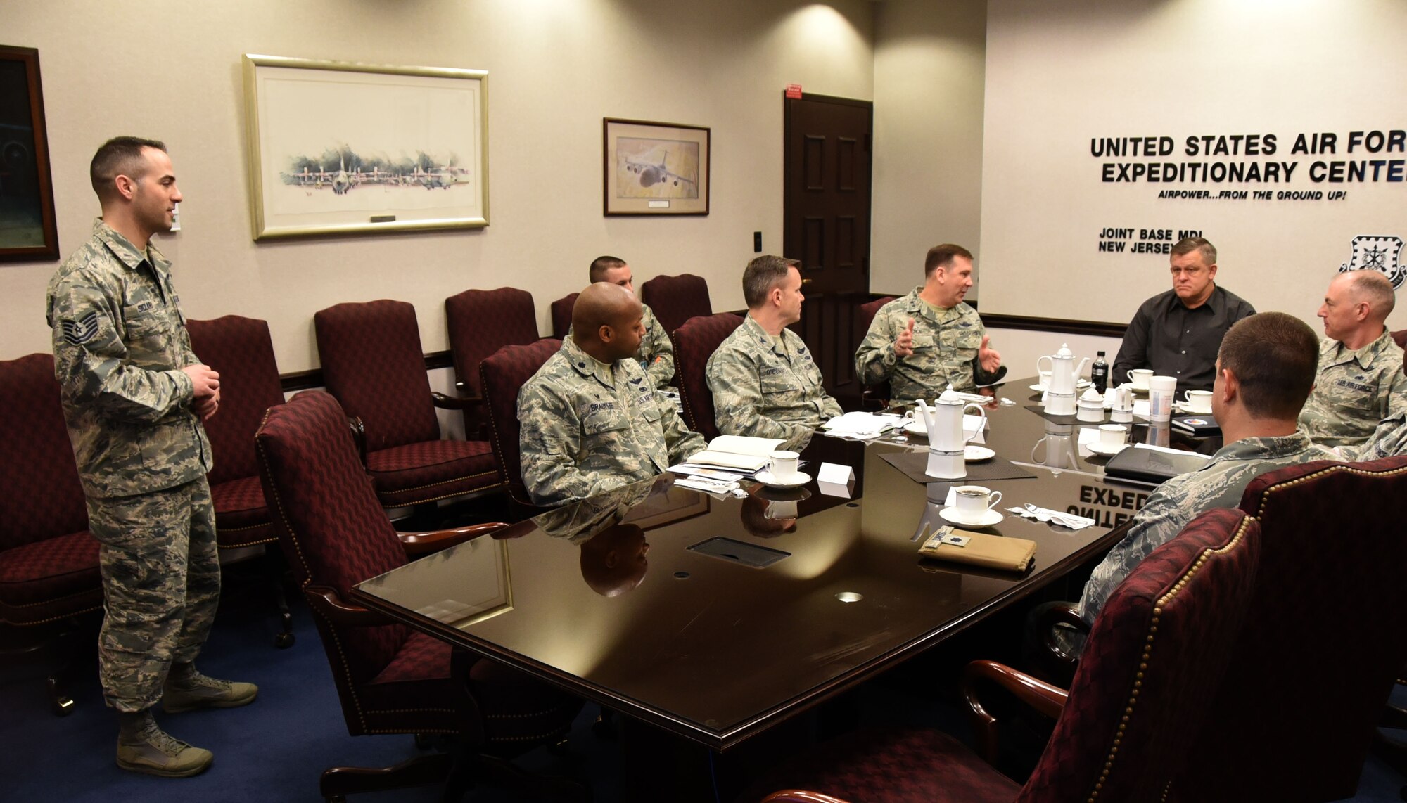Tech. Sgt. Kevin Siclari, Executive Assistant to the Command Chief United States Air Force Expeditionary Center, briefs retired Gen. Frank Gorenc, formally the U.S. Air Forces in Europe and Air Forces Africa commander, on how the EC's nine units deliver the R.A.P.I.D. in “Rapid Global Mobility.” (U.S. Air Force photo by Tech.Sgt. Jamie Powell)