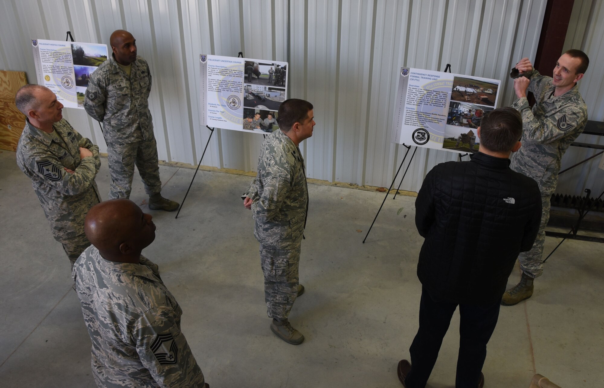 Tech. Sgt. Robert Leppla, an instructor with the 421st Combat Training Squadron  briefs retired Gen. Frank Gorenc, the former U.S. Air Forces in Europe and Air Forces Africa commander, on the Contingency Response Formal Training course taught at the Expeditionary Operations School. (U.S. Air Force photo by Tech. Sgt. Jamie Powell)